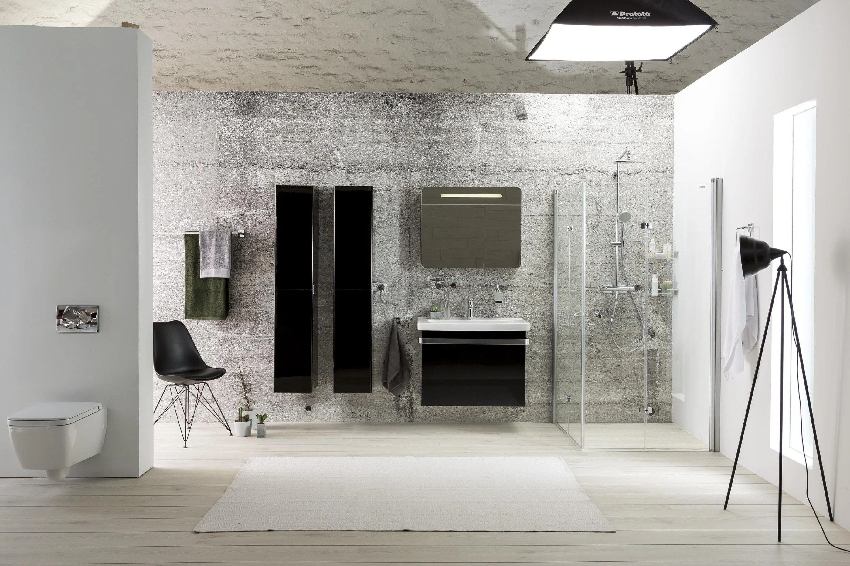 Professional photography studio setup with lighting equipment, camera tripod, backdrop reflectors, and studio lighting demonstrating the production process for Alterna product photography.