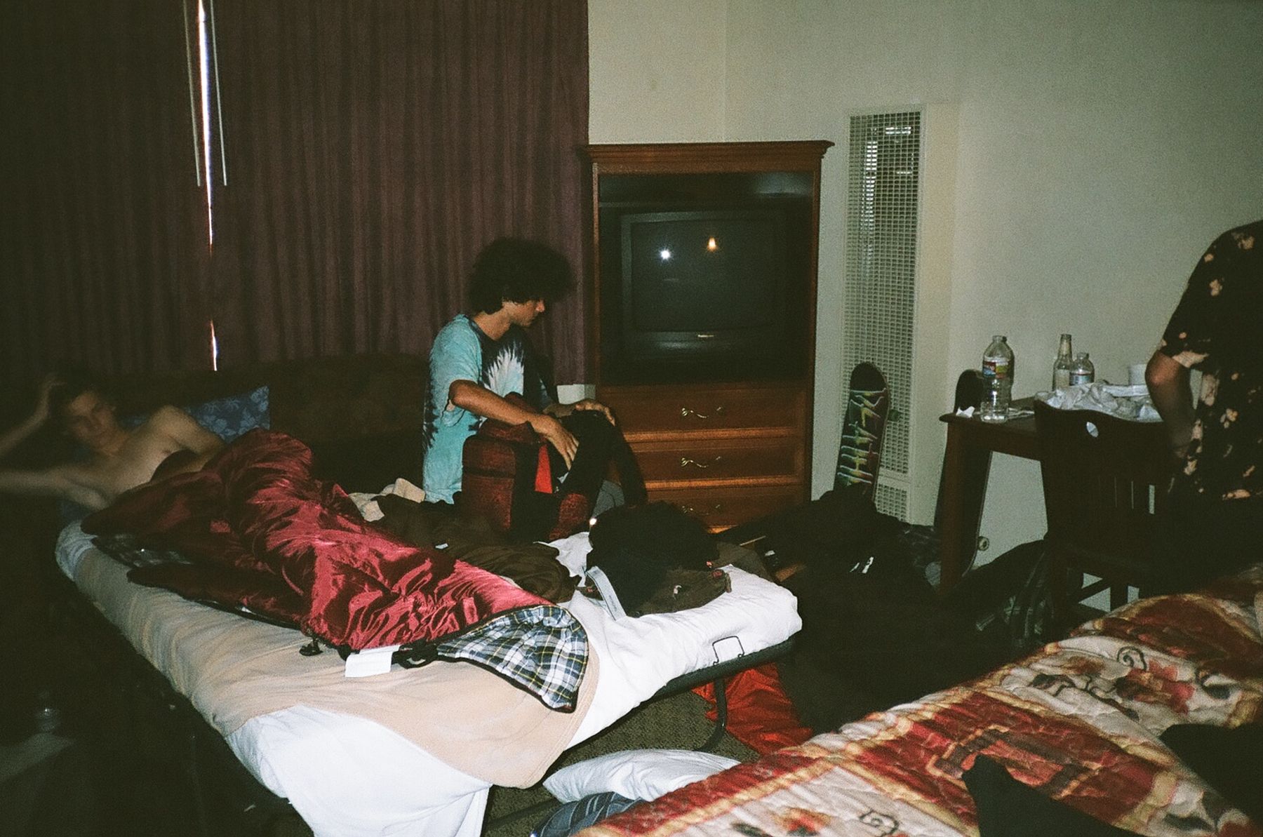 Seven or eight to a room in the Tenderloin. Woken up by bums lighting a dumpster on fire in the middle of the night.