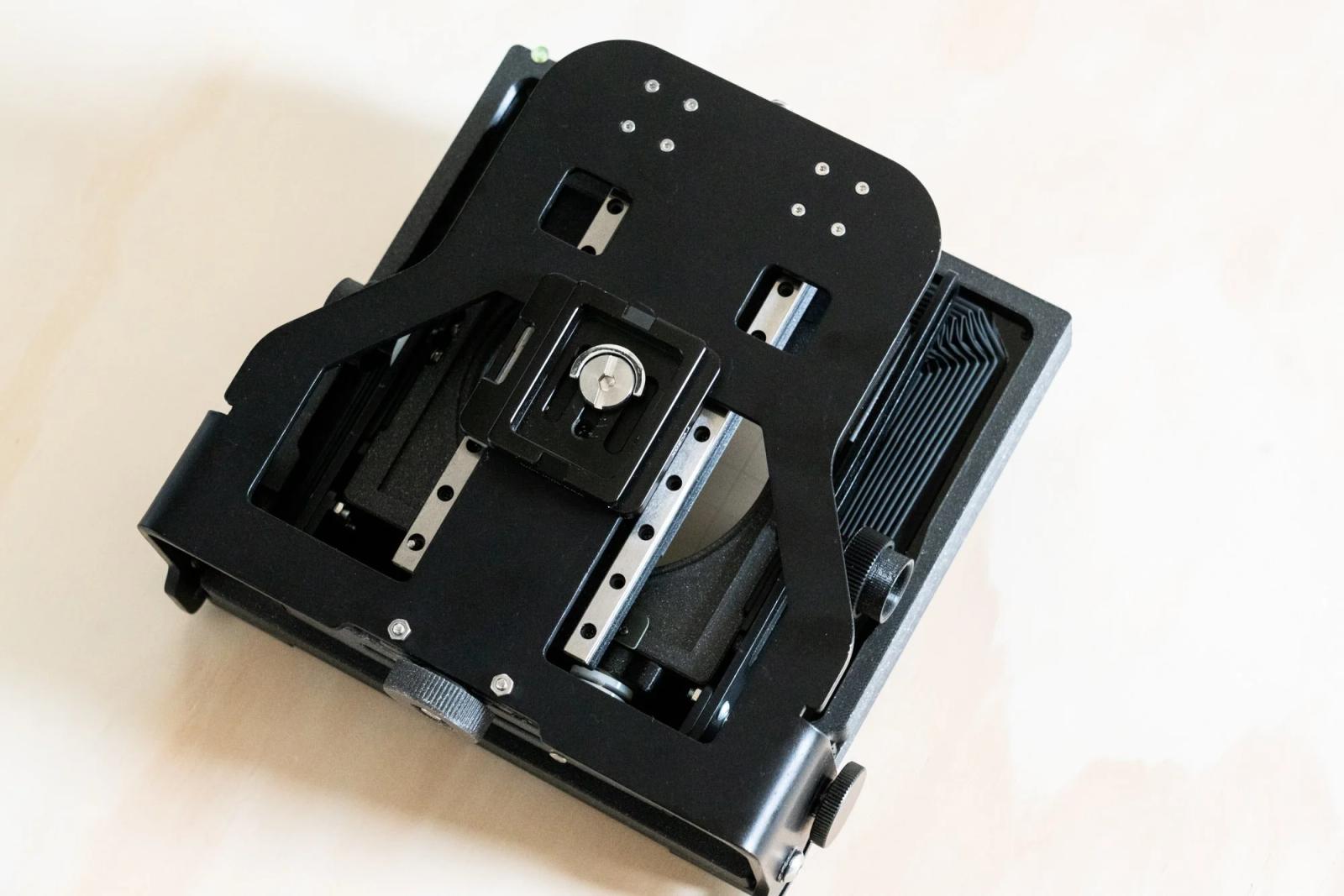 The Intrepid 4x5 has an all-metal base that spans the length and width of the camera, meaning that it can stand up to the task of slightly expanding the Shimoda backpack’s volume.
