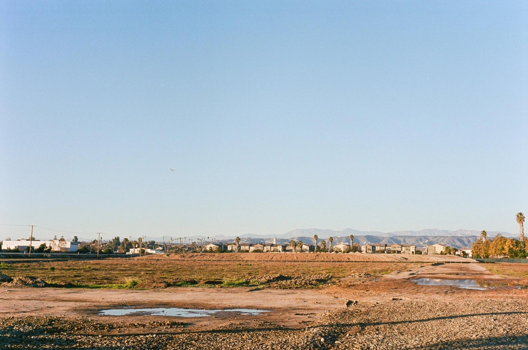 Looking north towards the ParkWest Townhomes, the final tract of farmland is turned over to complete the development of the Imation/Dawson Drive area. 2022.