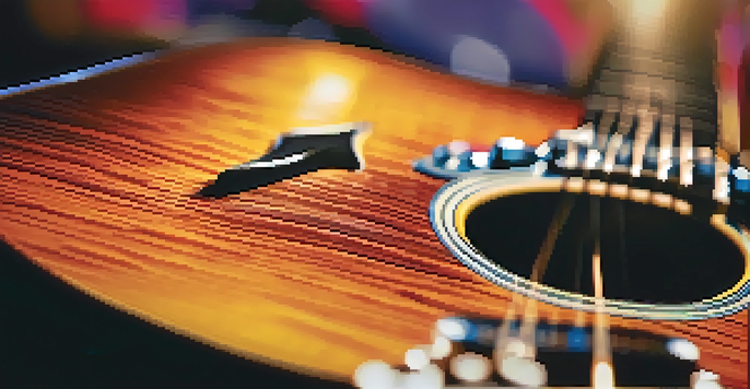 A close-up of a guitar with visible wood grain and shiny strings, set against a blurred background of a colorful rock concert.
