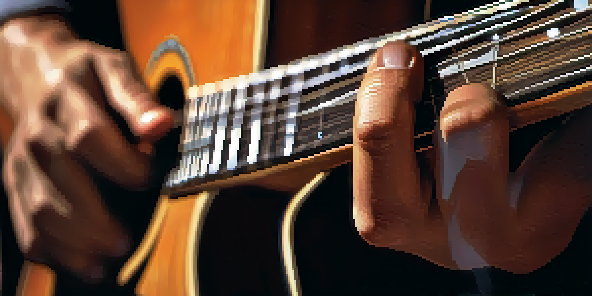 A close-up of a guitarist's hands sweating on the fretboard, with an intense look of concentration, softly blurred background.