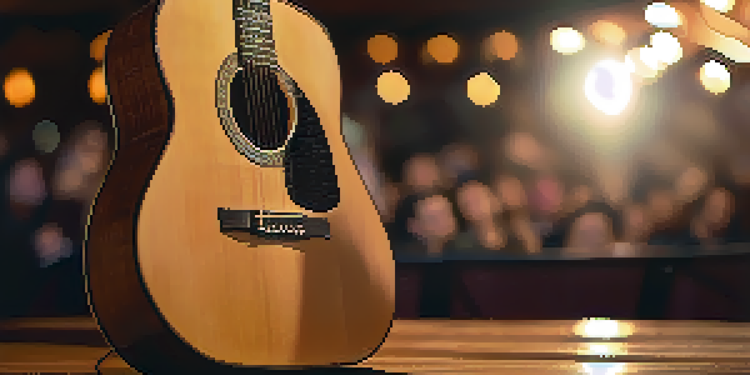 A close-up of an acoustic guitar on a wooden stage with warm lighting and blurred audience silhouettes in the background.