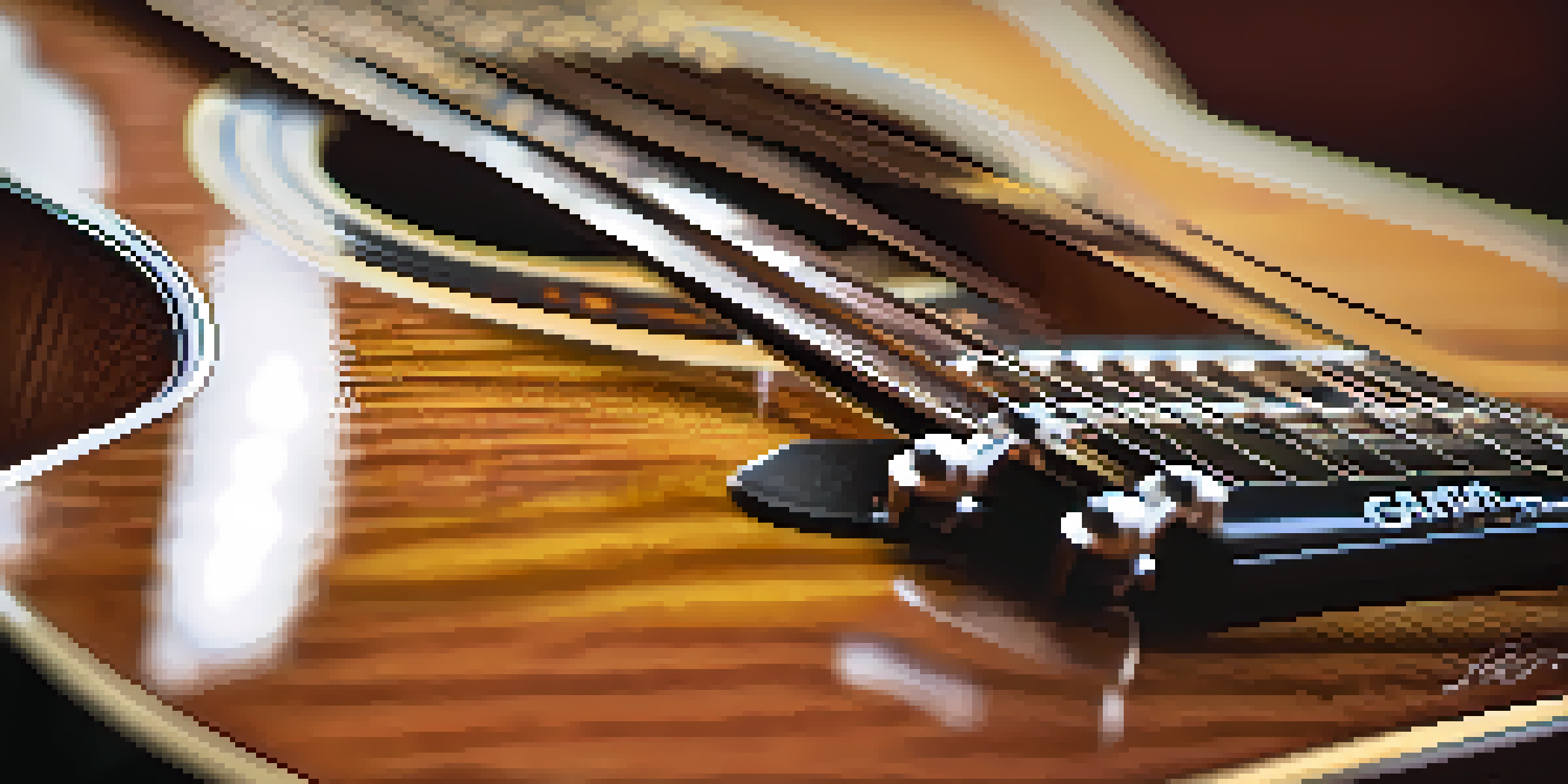 A close-up of a guitar neck with a capo on the second fret, highlighting the strings and the wooden texture of the guitar in warm lighting.