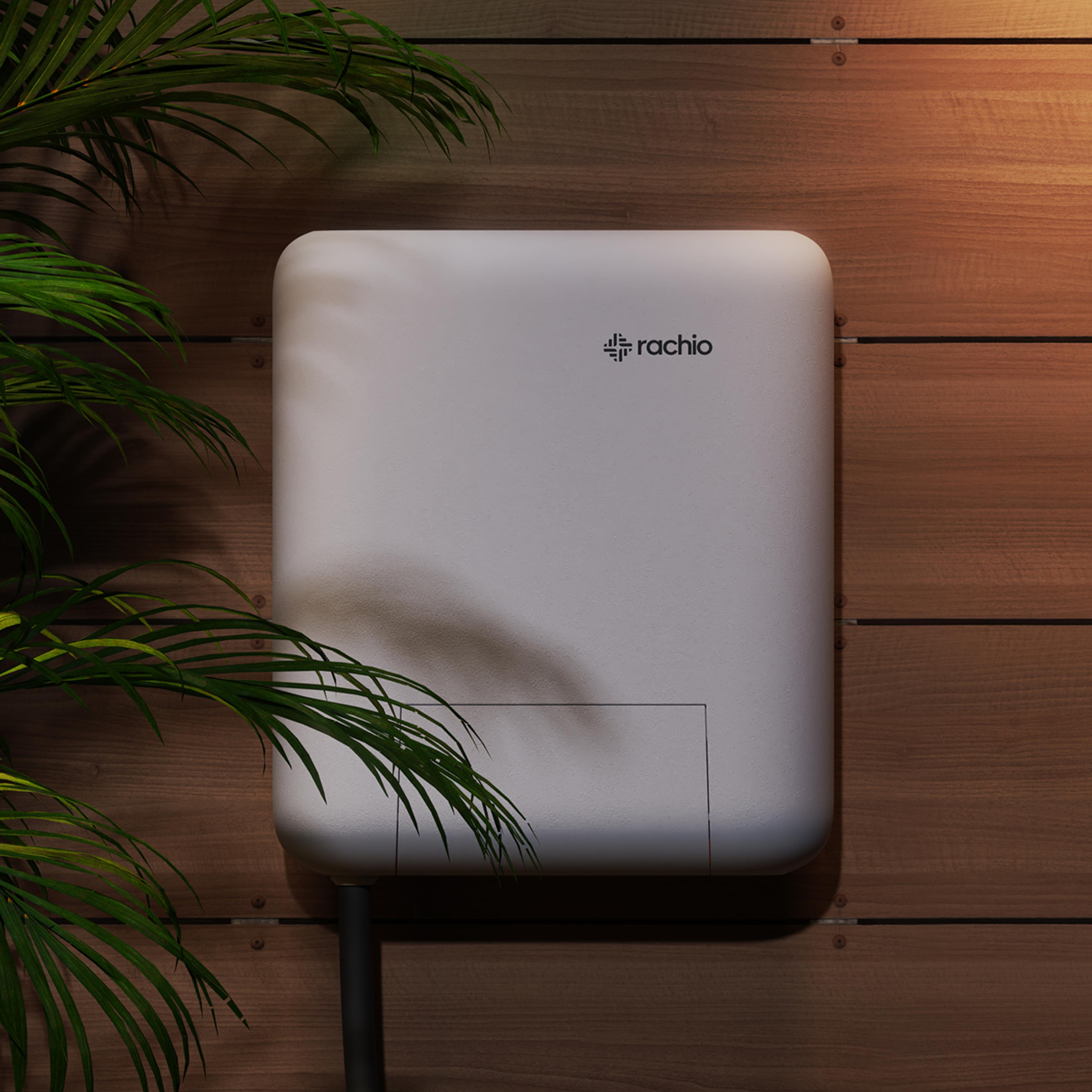 Rachio Smart Lighting Controller mounted outdoors at night.