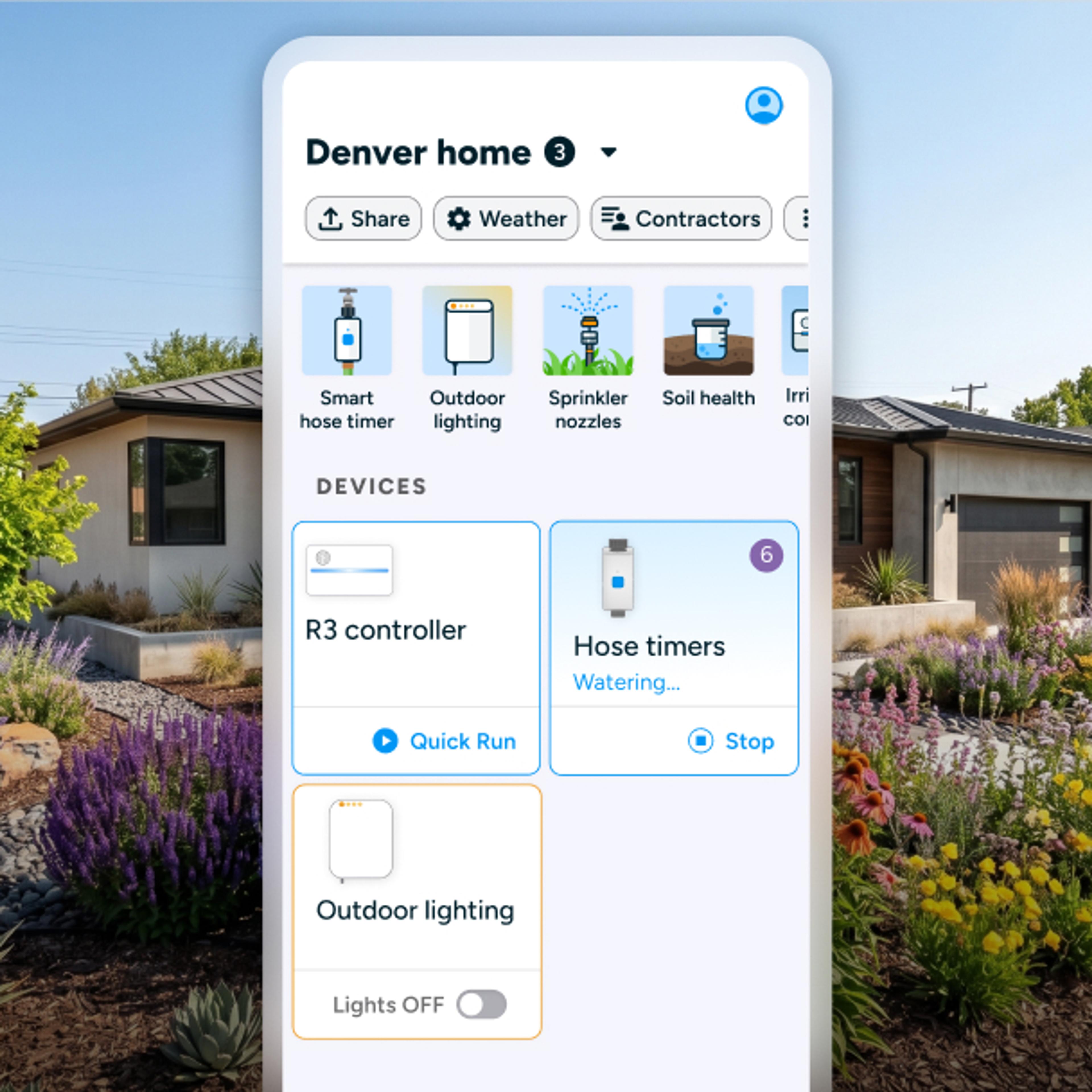 Person touching Rachio Smart Sprinkler Controller installed outdoors in weatherproof enclosure.