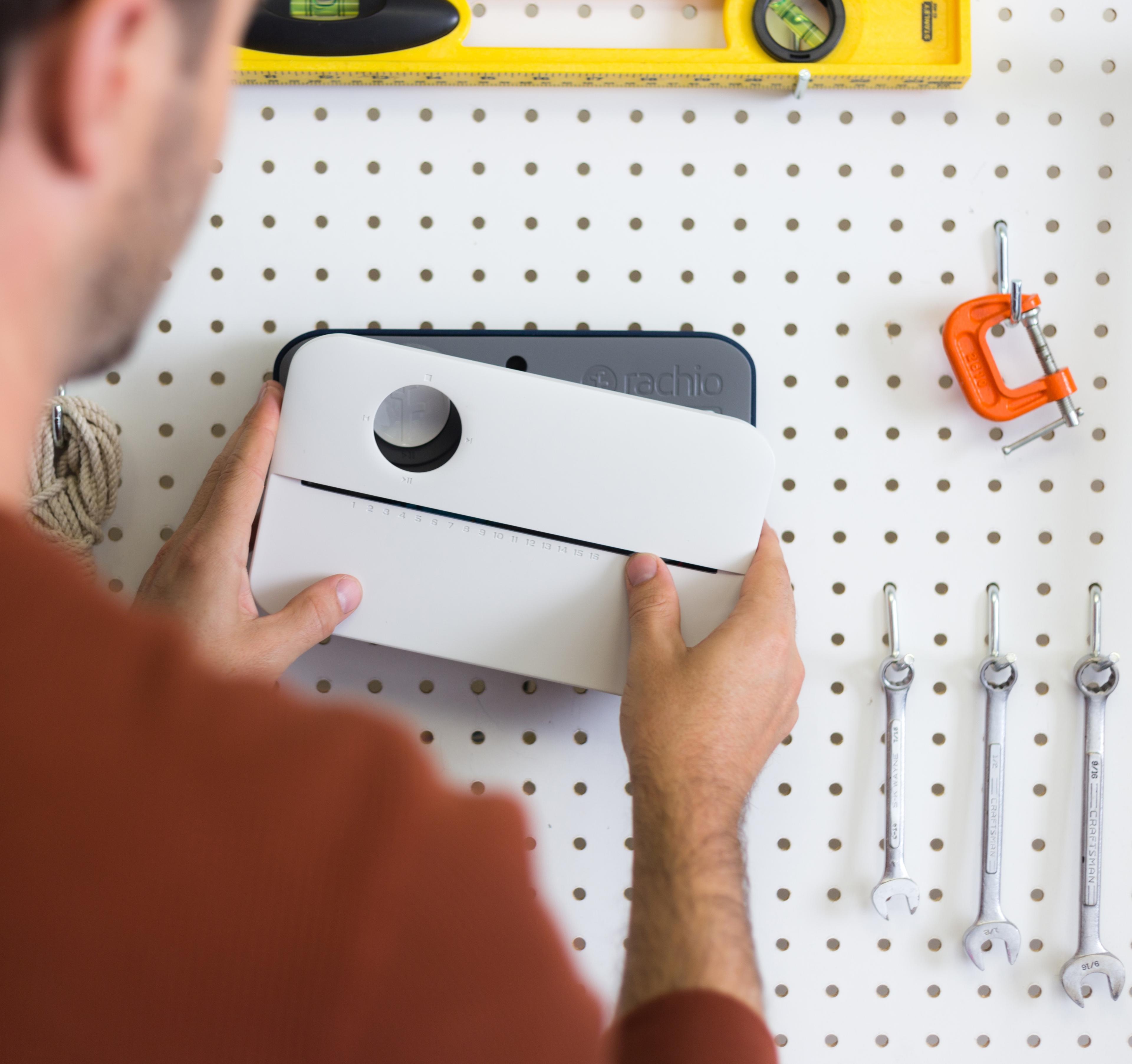 Man installing Rachio controller.
