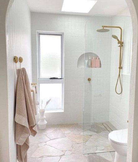 Bathroom with Clovelly Stone Look Crazy Paving Tile floor and golden shower