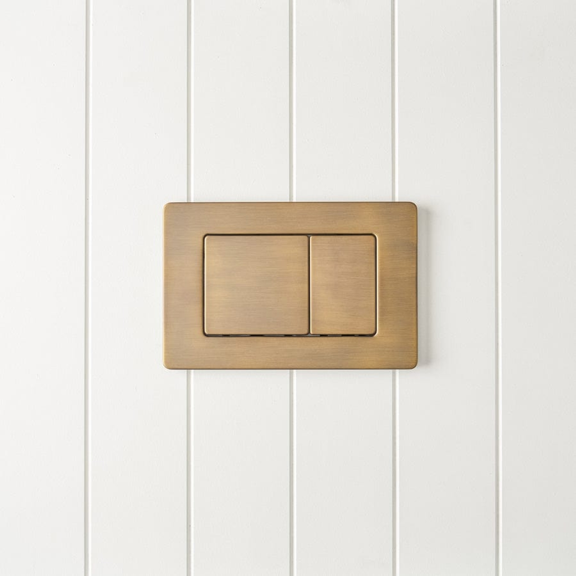 Angled In-Wall Toilet With Rectangle Antique Brass Buttons | Yabby