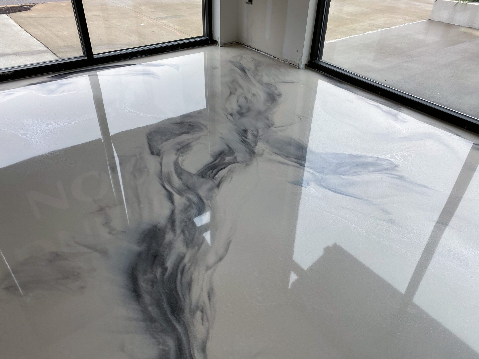 Four Corners metallic epoxy floor with marbled finish