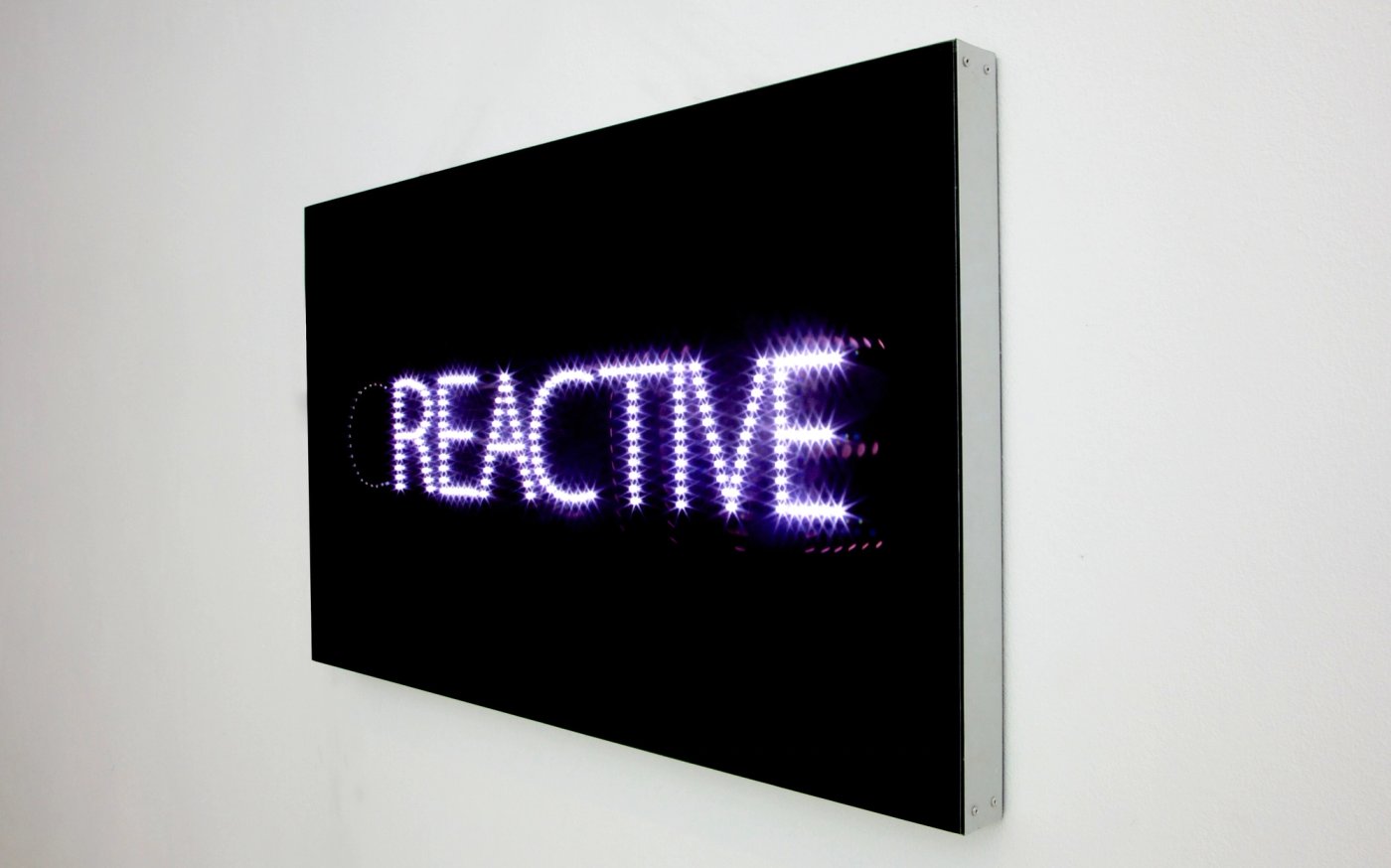 Creative / Reactive, shown to scale on a gallery wall