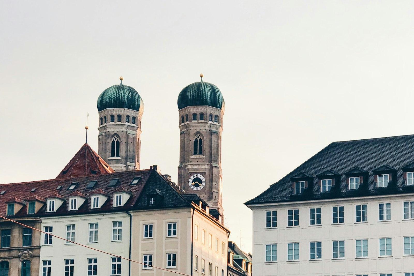 Munich old-town rooftops beneath the Frauenkirche towers