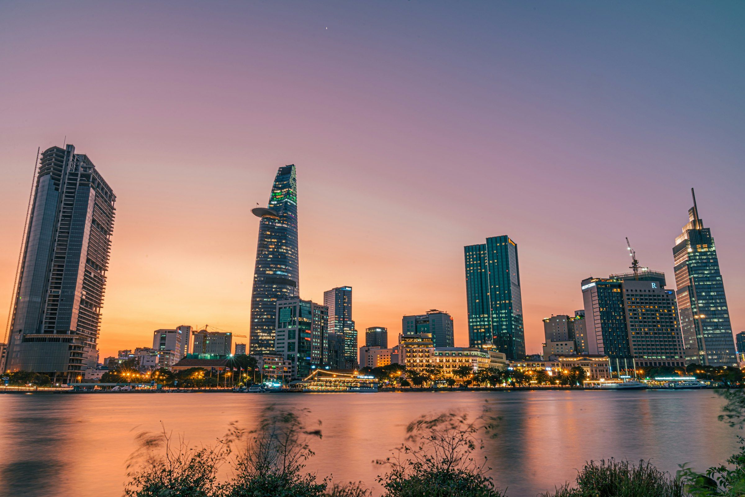 A busy Saigon street scene at dusk.