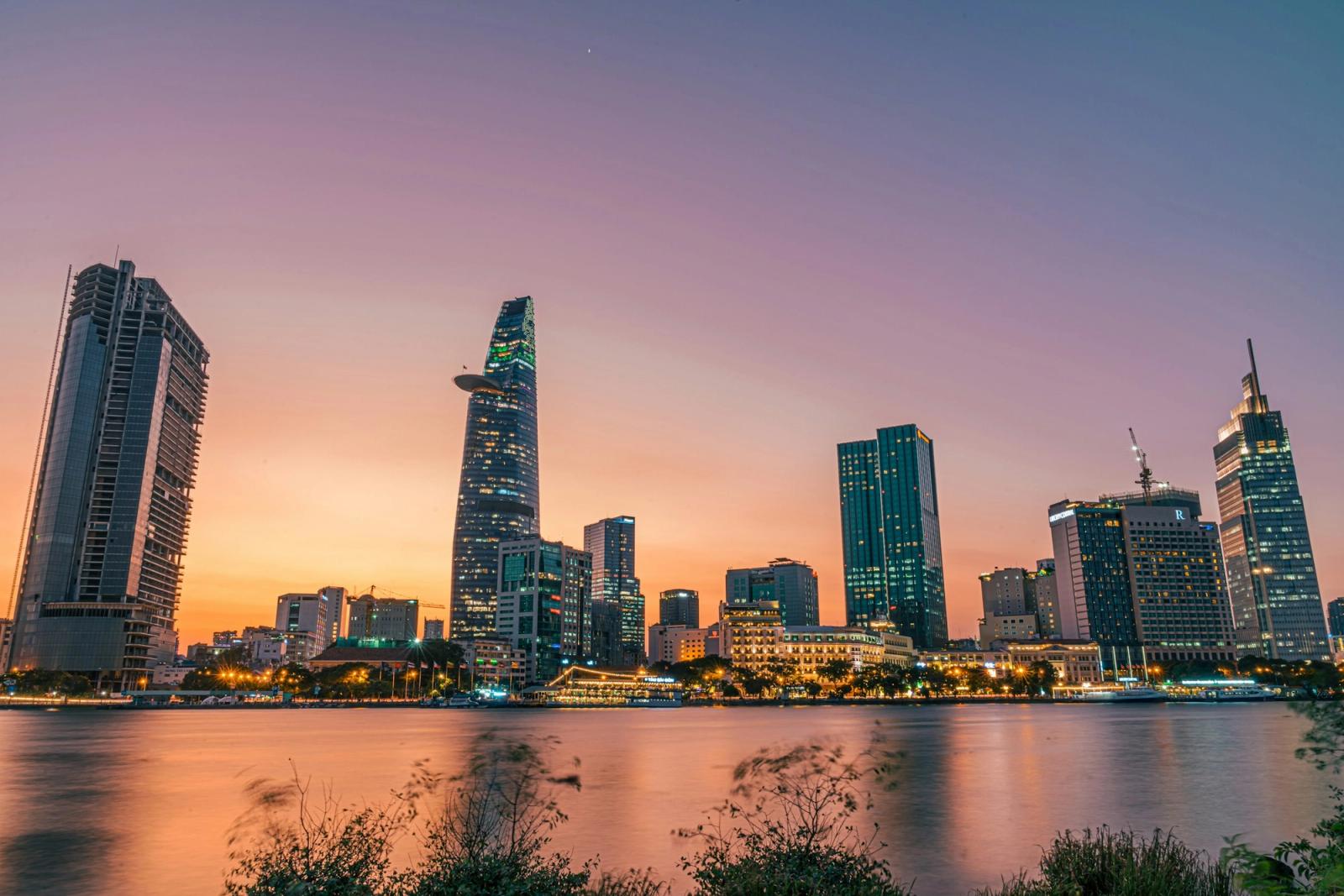 A busy Saigon street scene at dusk.