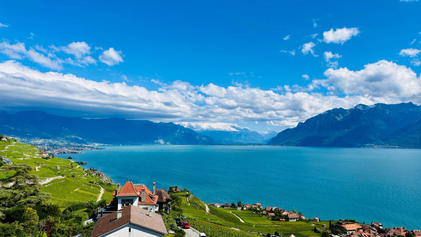 Stunning aerial view of Lake Geneva, vineyards, and mountains from Chexbres, Switzerland