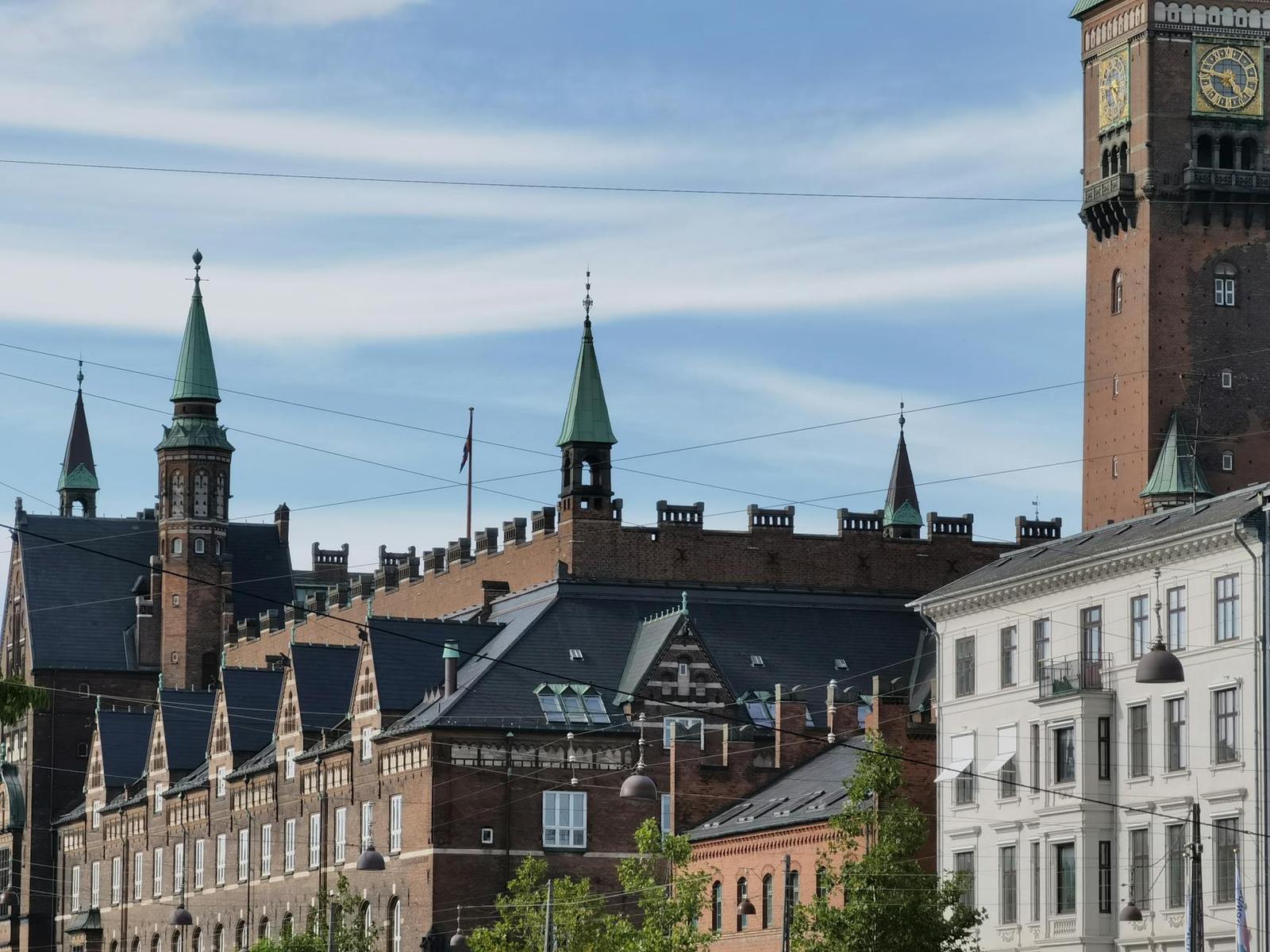 A scenic view of the historic City Hall building in Copenhagen, Denmark