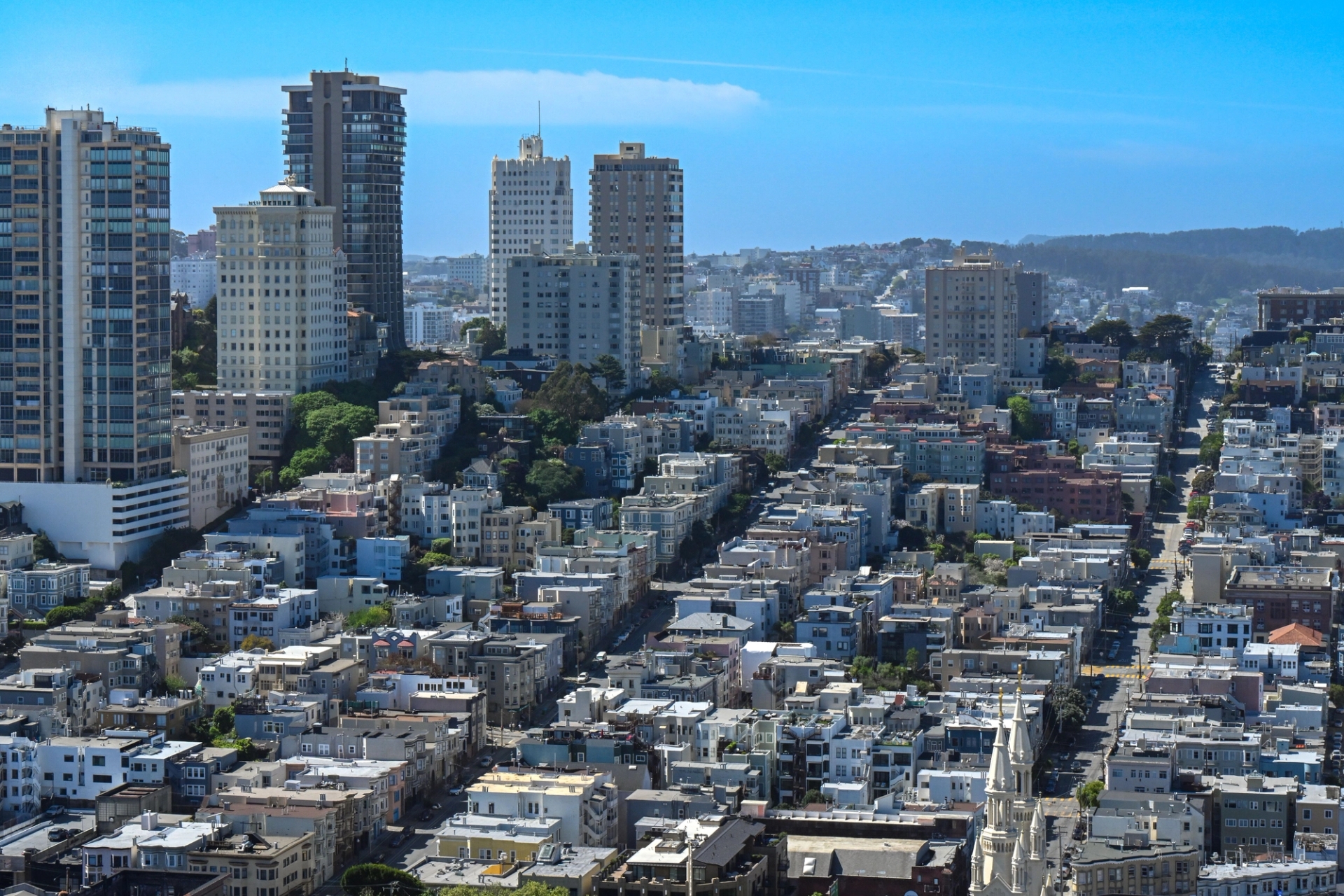 Aerial view of San Francisco's urban landscape showcasing high-rise buildings and residential areas