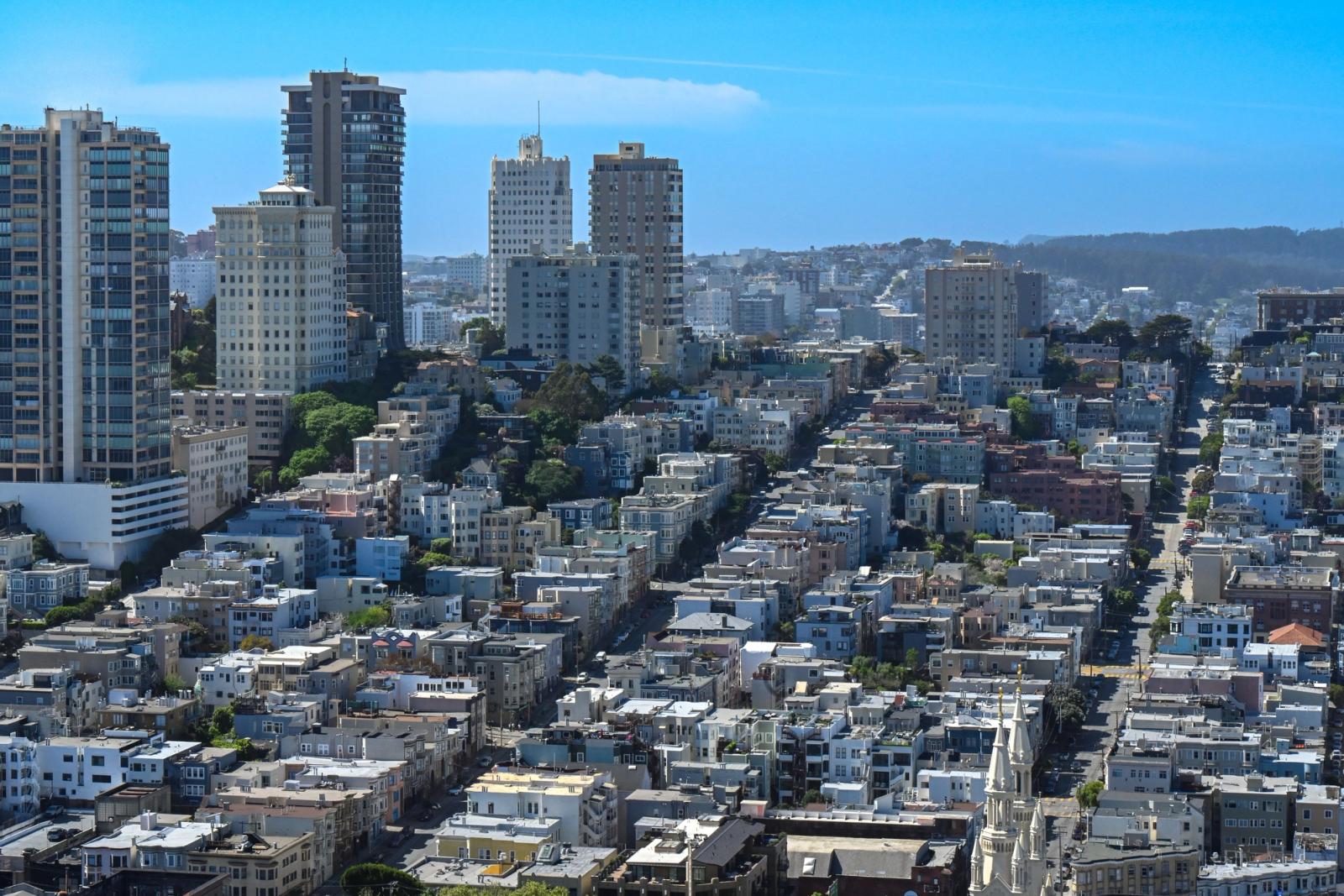 Aerial view of San Francisco's urban landscape showcasing high-rise buildings and residential areas