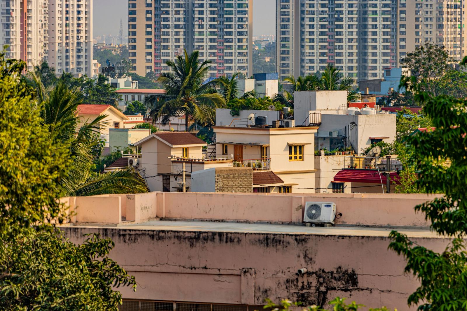 A vibrant cityscape of Bhubaneswar with modern buildings and lush greenery