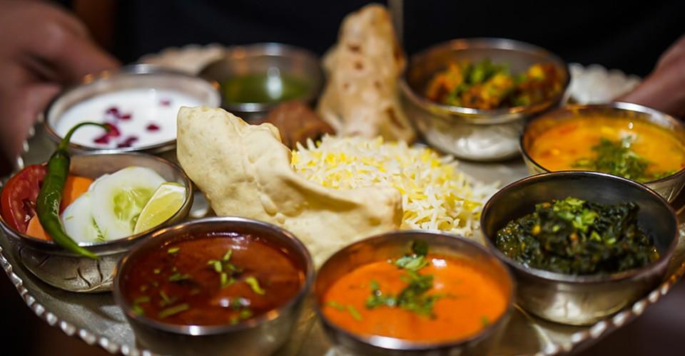 A traditional thali served on silverware aboard