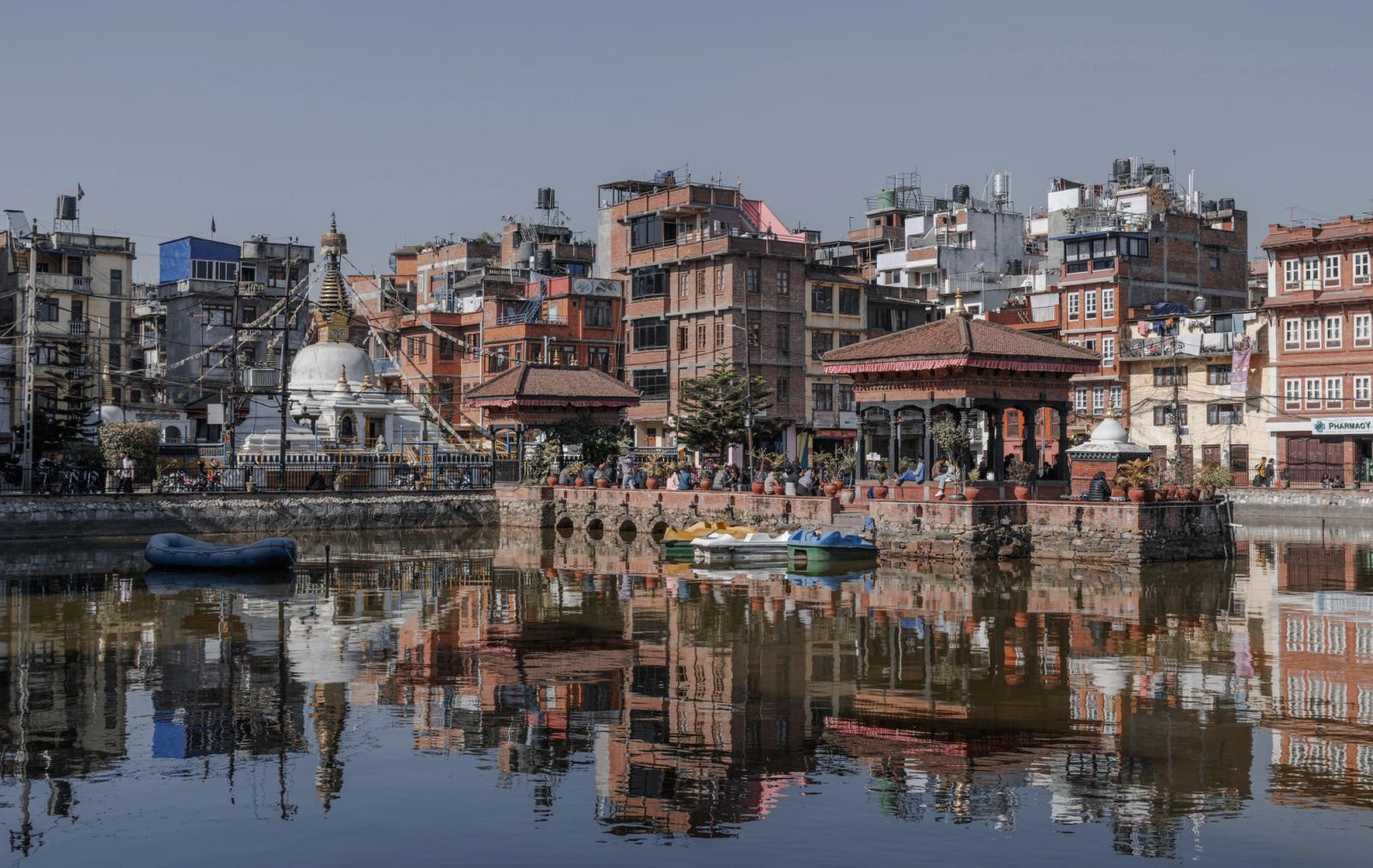 Scenic view of Patan's historic temple and cityscape reflecting in the Bagmati River in Kathmandu, Nepal