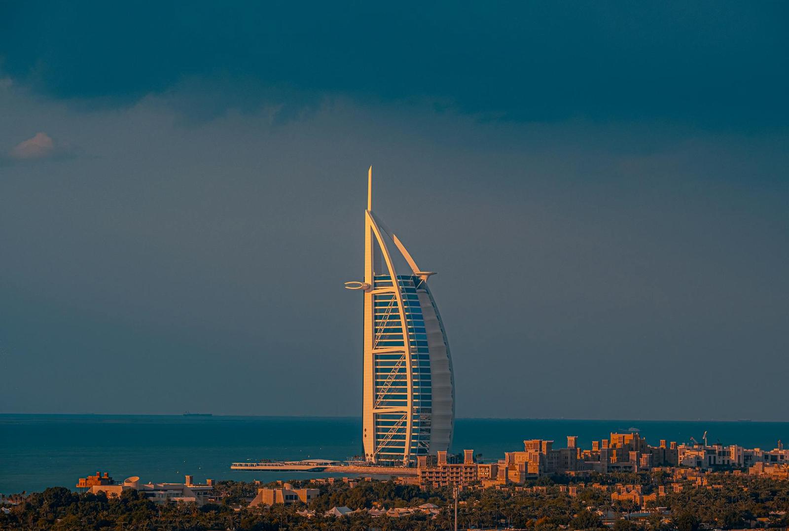 Gorgeous sunset view of the iconic Burj Al Arab hotel in Dubai against the sea