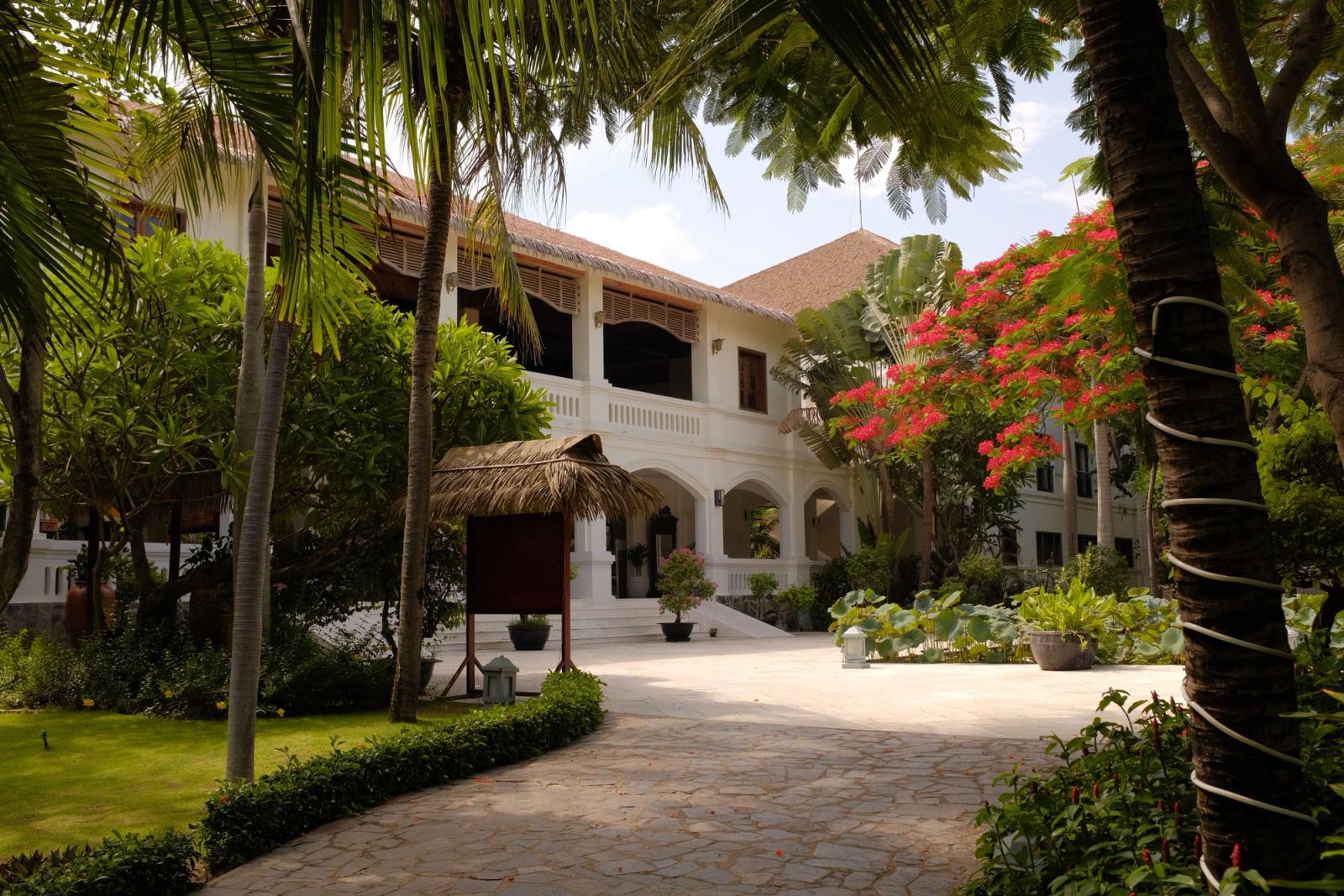 Tranquil resort in Mũi Né, Vietnam showcasing beautiful French colonial architecture amid lush gardens
