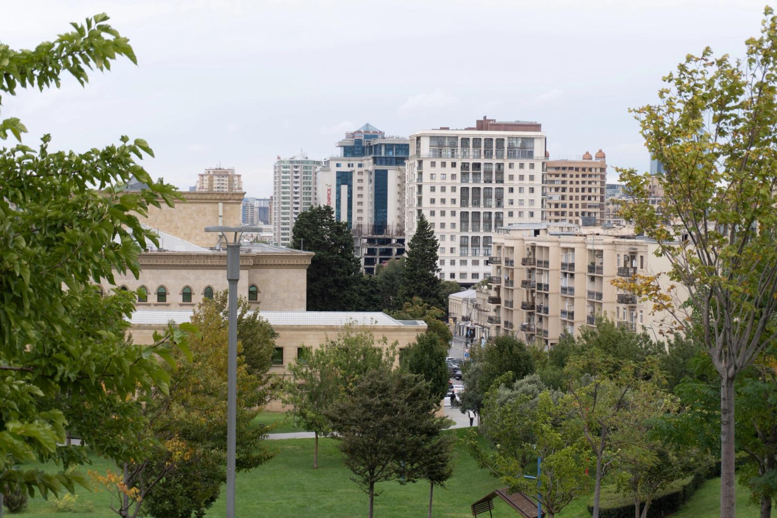 Scenic view of Baku cityscape with modern buildings and greenery