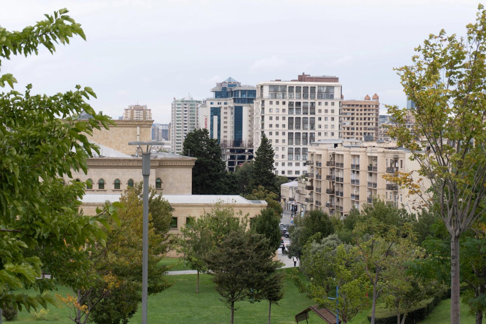 Scenic view of Baku cityscape with modern buildings and greenery