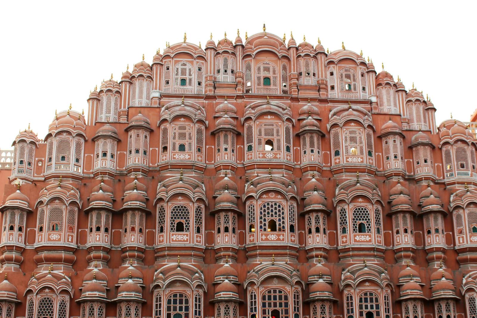 An ornate Indian palace facade at golden hour.
