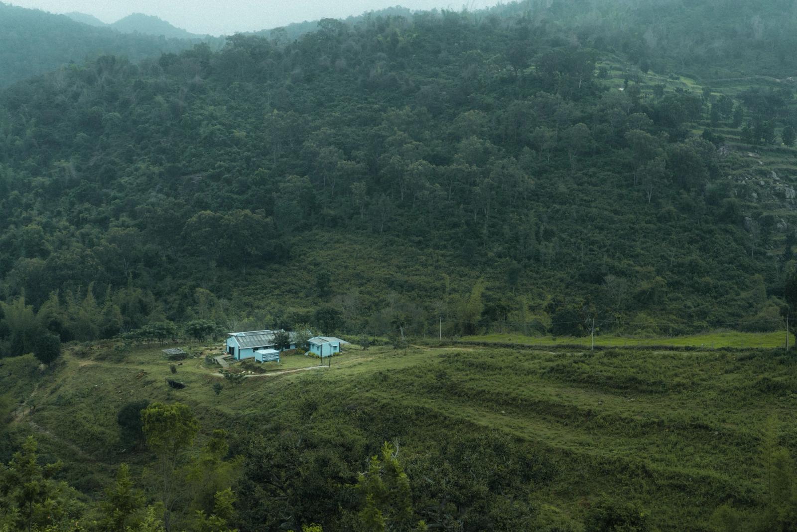 Serene aerial view of countryside homes in Martalli, India with lush greenery