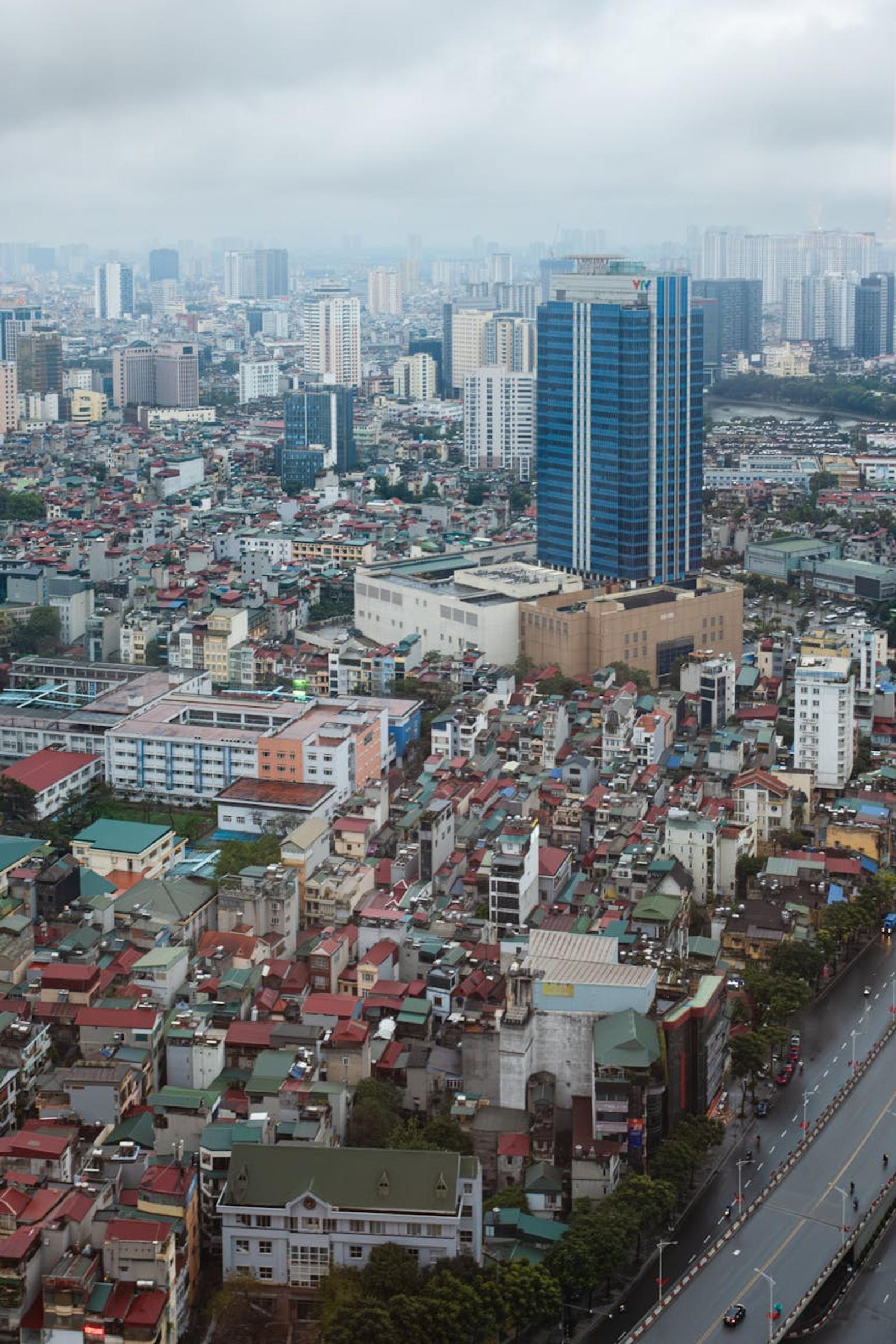 Aerial view of a dense low-rise cityscape under overcast sky