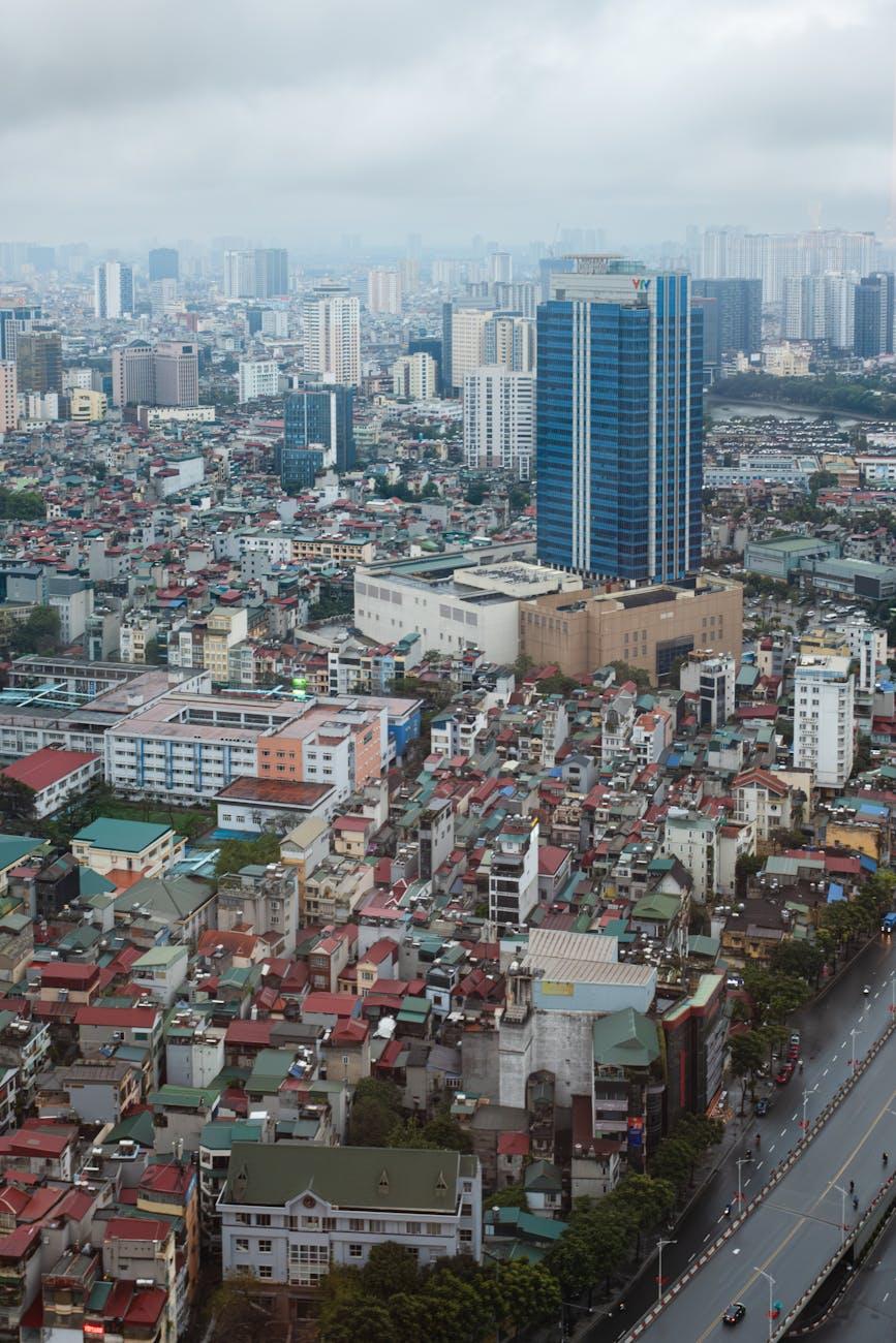 Aerial view of a dense low-rise cityscape under overcast sky