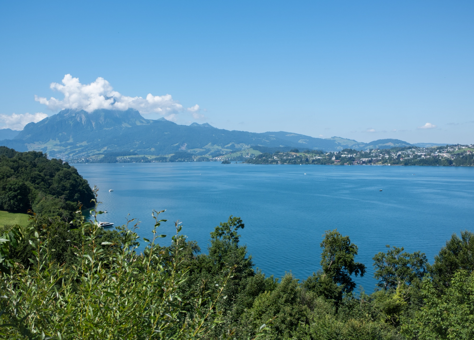 Breathtaking summer view of Lake Lucerne and Mount Pilatus in Switzerland, showcasing pristine nature