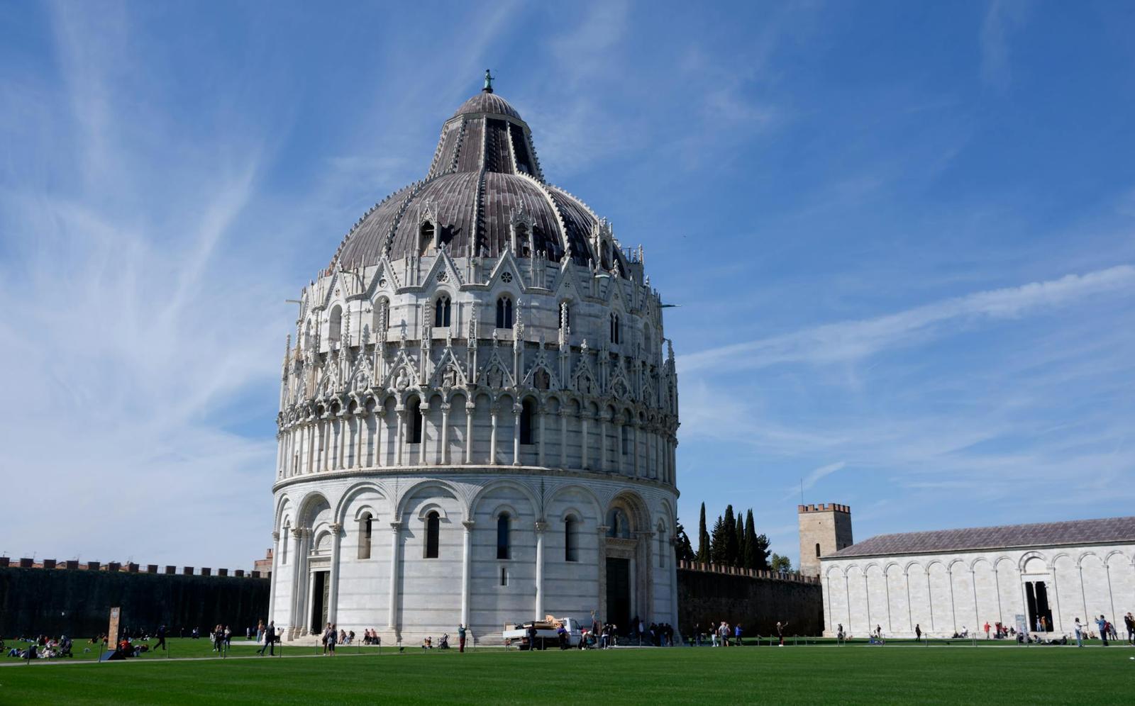 White domed baptistery building standing on an open lawn