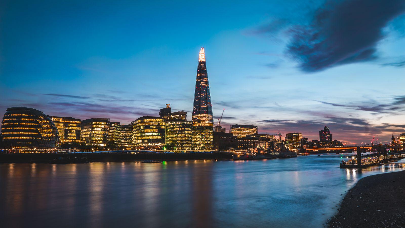The Shard lit at dusk above the Thames, London