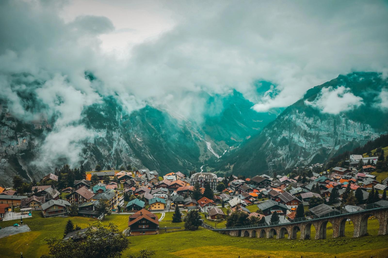 Breathtaking view of Lauterbrunnen village nestled in the Swiss Alps, surrounded by stunning mountainous landscape