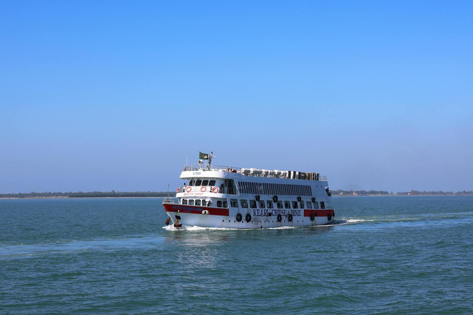 Cruise ship navigating the waters of Cox's Bazar, Bangladesh on a clear day
