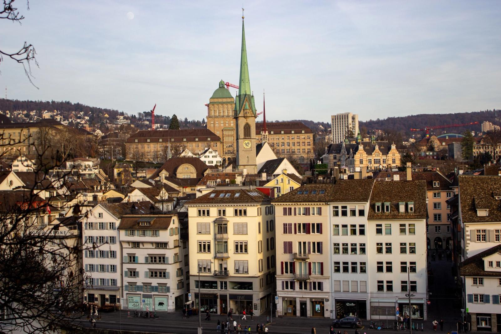 Capture of Zurich's historic architecture and St. Peter's Church in warm evening light