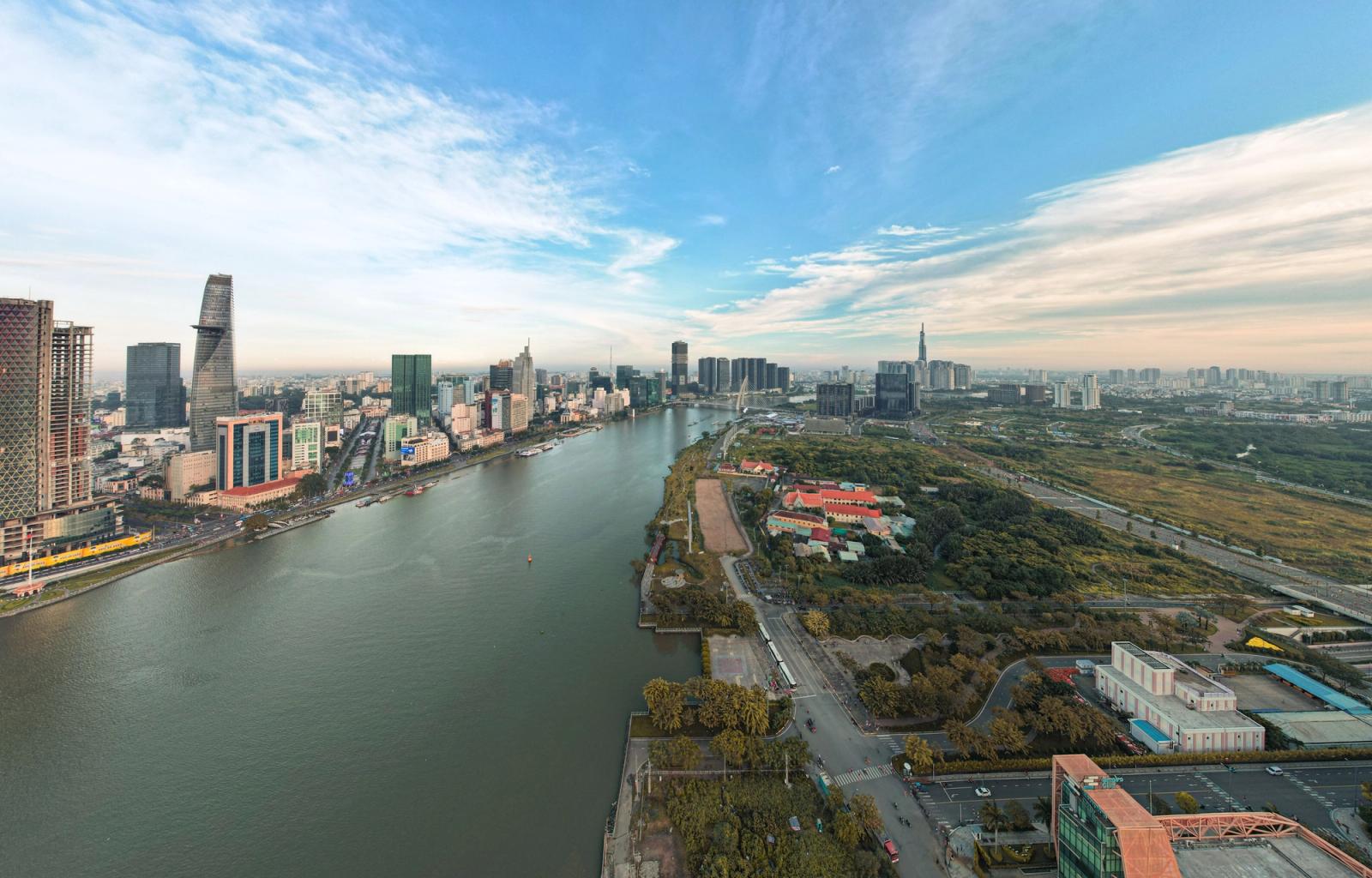 A panoramic aerial view of the Ho Chi Minh City skyline along the Saigon River