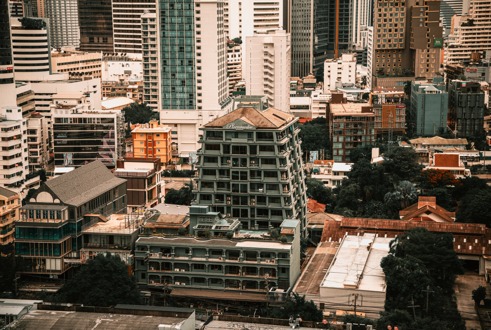 Aerial view showcasing the diverse architecture of Bangkok, Thailand's skyline with modern and classic buildings