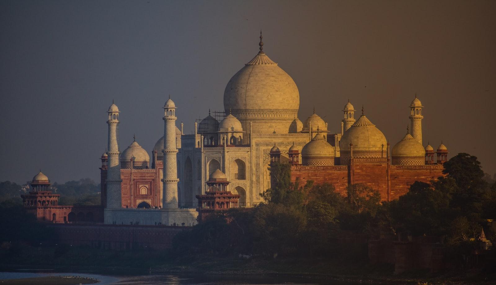 The Taj Mahal in evening light seen across the Yamuna