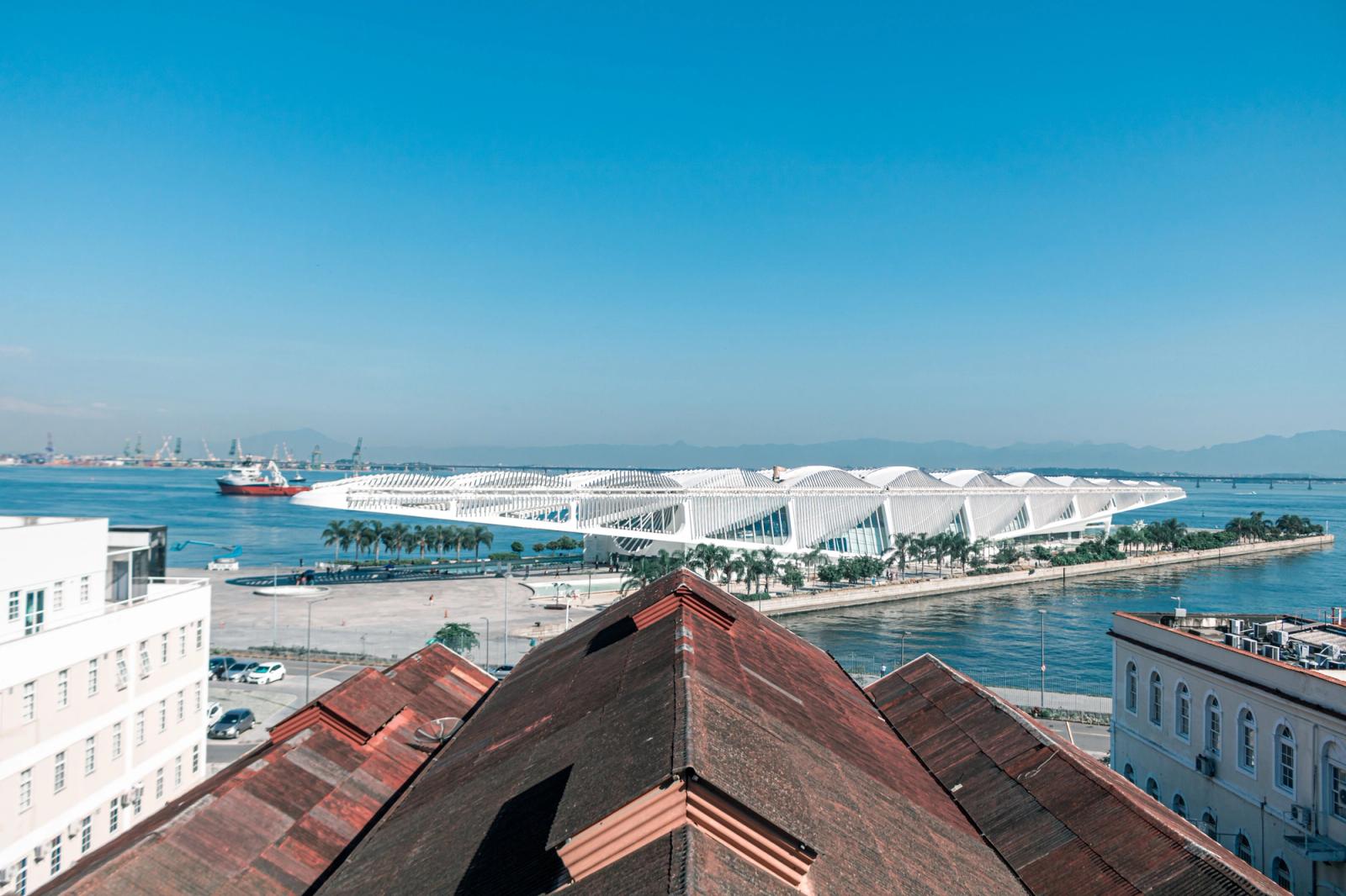 A breathtaking aerial view of the Museum of Tomorrow and waterfront in Rio de Janeiro under a clear blue sky