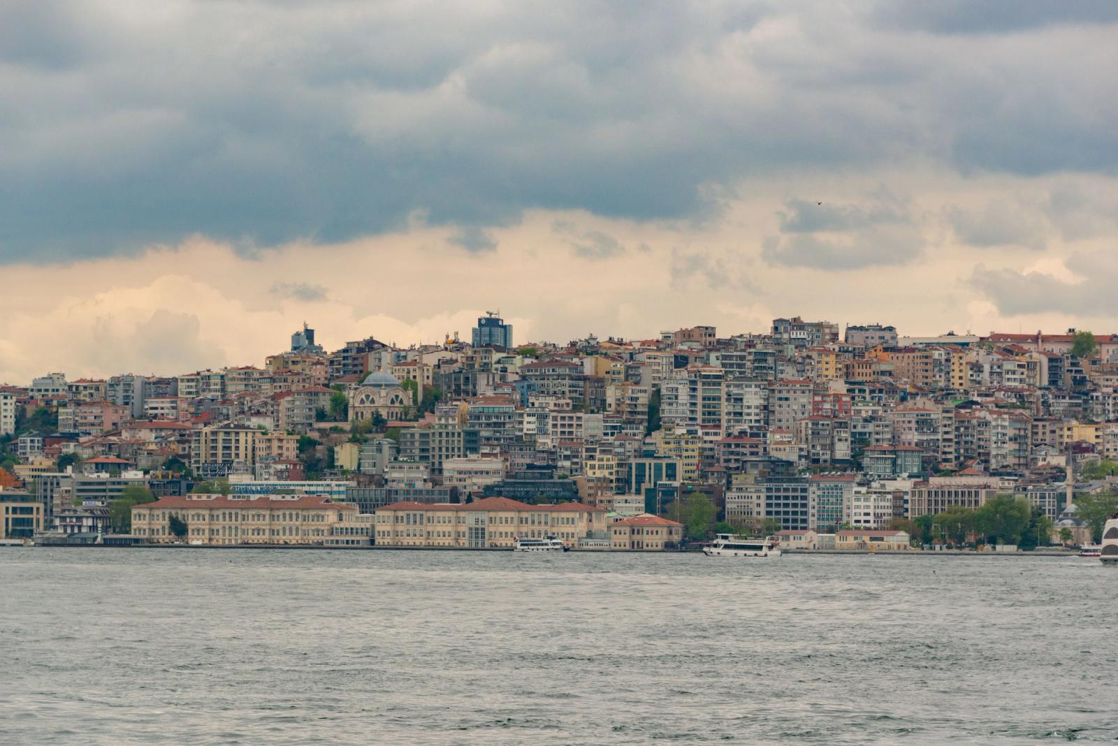 Majestic cityscape of Istanbul with Bosphorus waterfront under cloudy skies