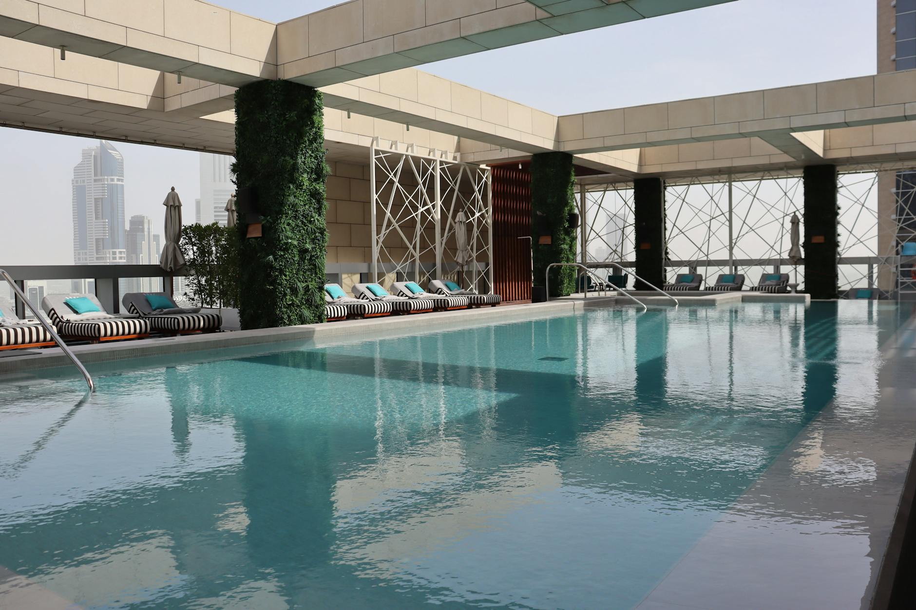 Dubai hotel rooftop pool with the city skyline beyond
