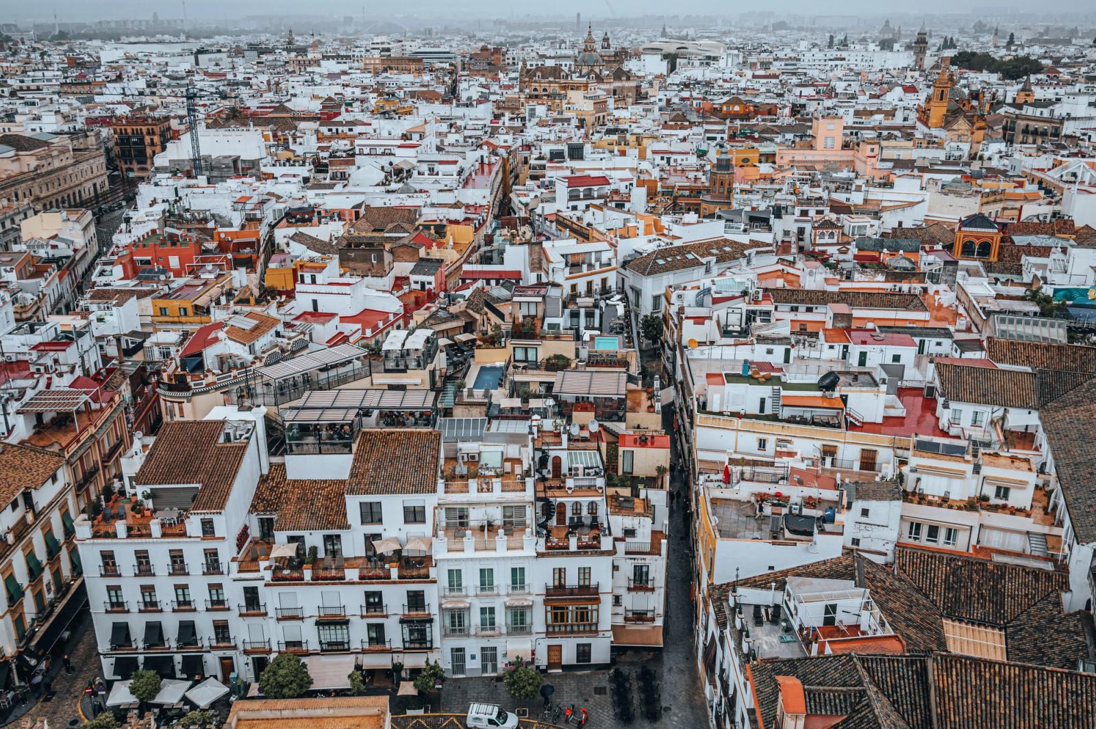 Explore the charming and colorful cityscape of Seville, Spain from above
