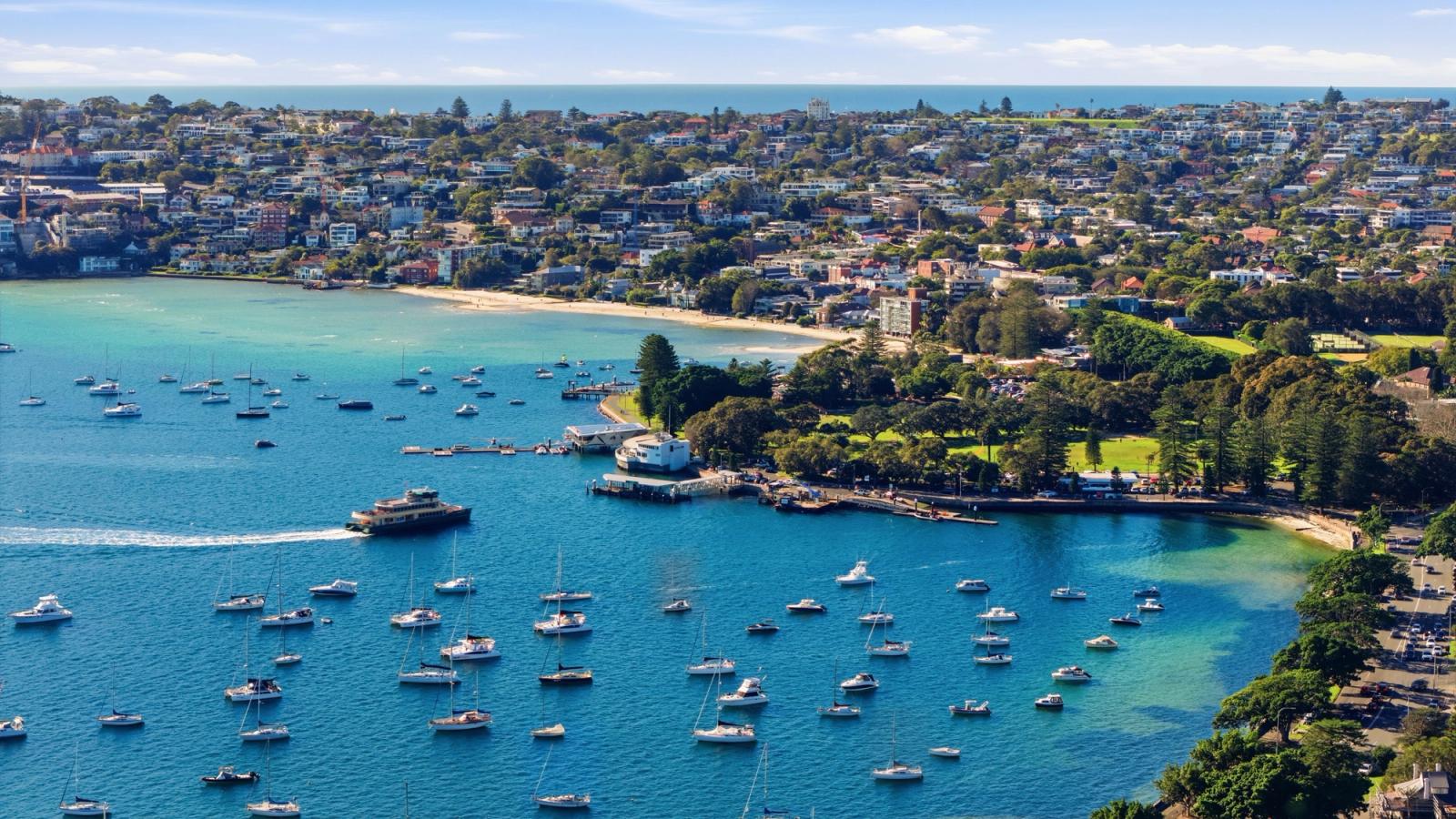 Aerial view of Manly Beach in Sydney with boats and a scenic coastal landscape