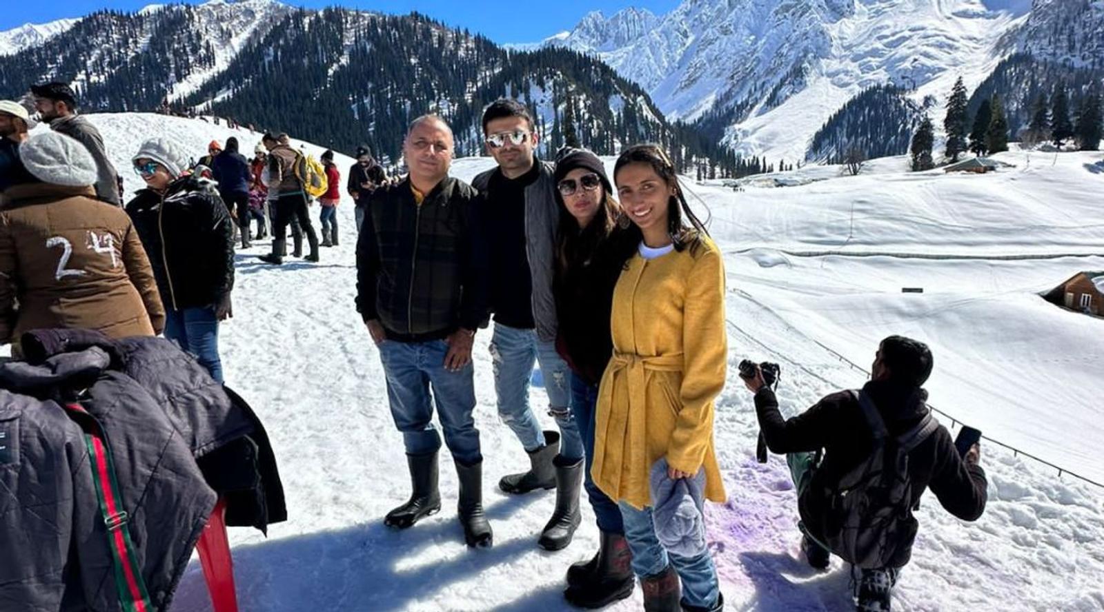 Group posing in a snowy landscape 