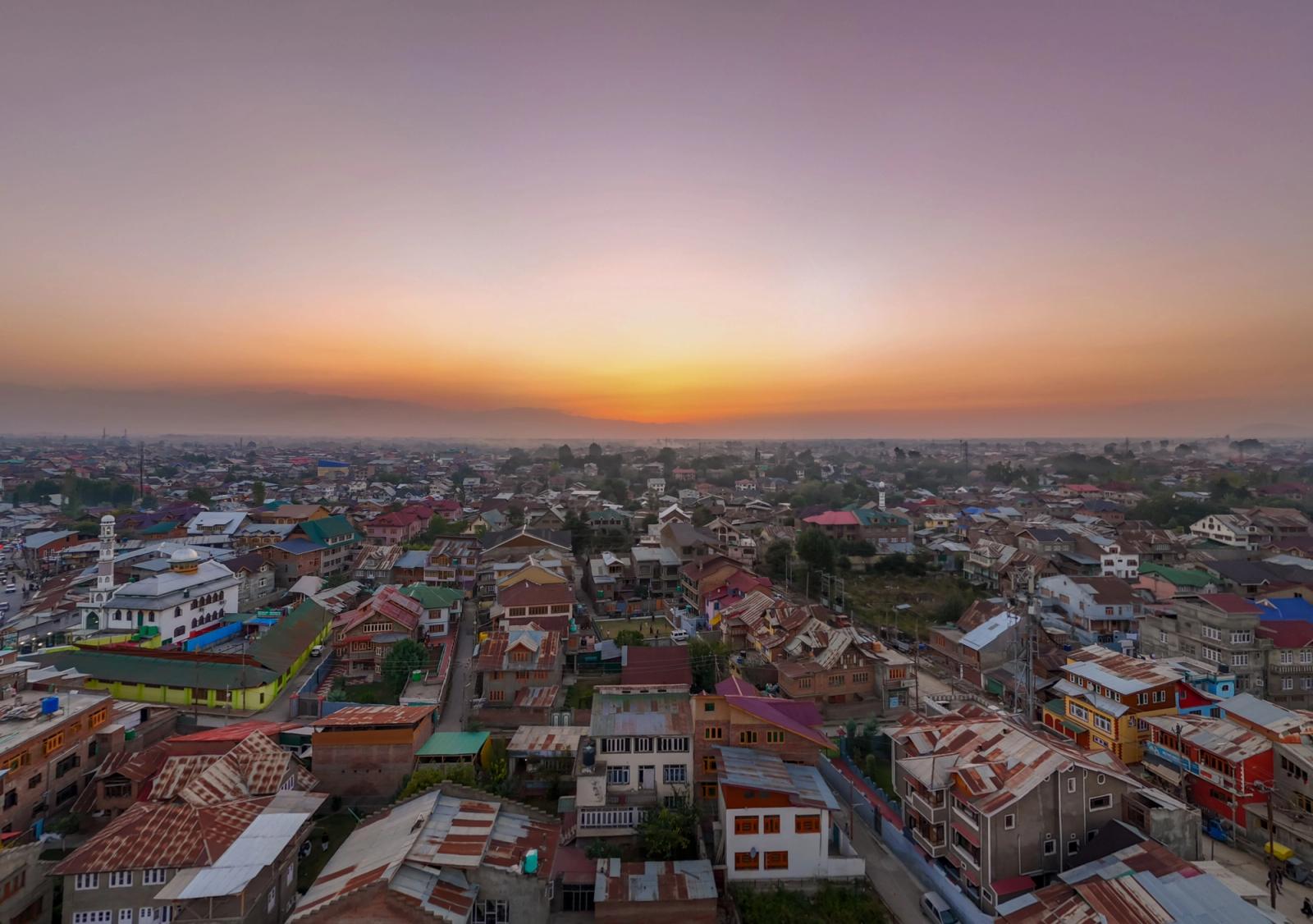 Captivating aerial view of Srinagar cityscape at sunset with vibrant colors and urban architecture