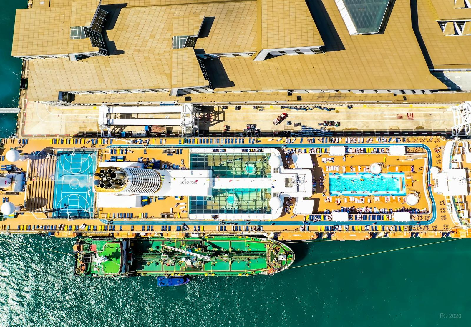 Aerial view of a cruise ship's sundeck with multiple swimming pools